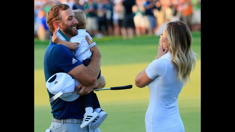 Dustin Johnson celebrates <a href="index.php?page=&url=http%3A%2F%2Fwww.cnn.com%2F2016%2F06%2F19%2Fgolf%2Fgolf-us-open-johnson-penalty-lowry%2F" target="_blank">his U.S. Open victory</a> with his fiancee, Paulina Gretzky, and their son, Tatum, on Sunday, June 19. It was the first major victory for Johnson, who finished second in the U.S. Open last year.