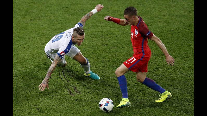 England's Jamie Vardy tries to dribble past Juraj Kucka.