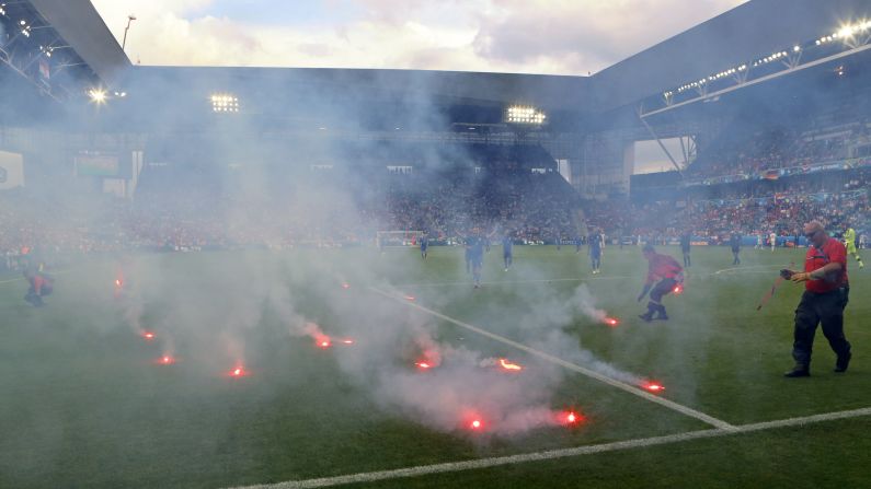 Flares, thrown onto the field from the stands, <a href="index.php?page=&url=http%3A%2F%2Fwww.cnn.com%2F2016%2F06%2F17%2Ffootball%2Fgallery%2Feuro-2016-day-8%2Findex.html" target="_blank">interrupt the Euro 2016 match</a> between Croatia and the Czech Republic on Friday, June 17. The match ended 2-2 in Saint-Etienne, France.