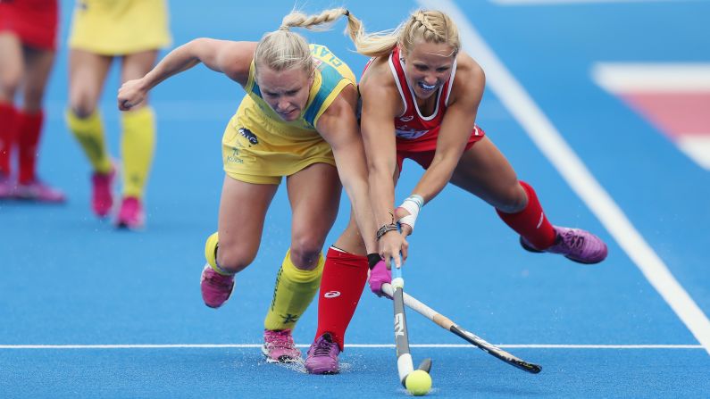 Australia's Jane Claxton, left, battles with American Kelsey Kolojejchick during a Hockey Champions Trophy match in London on Saturday, June 18. The match ended 2-2.