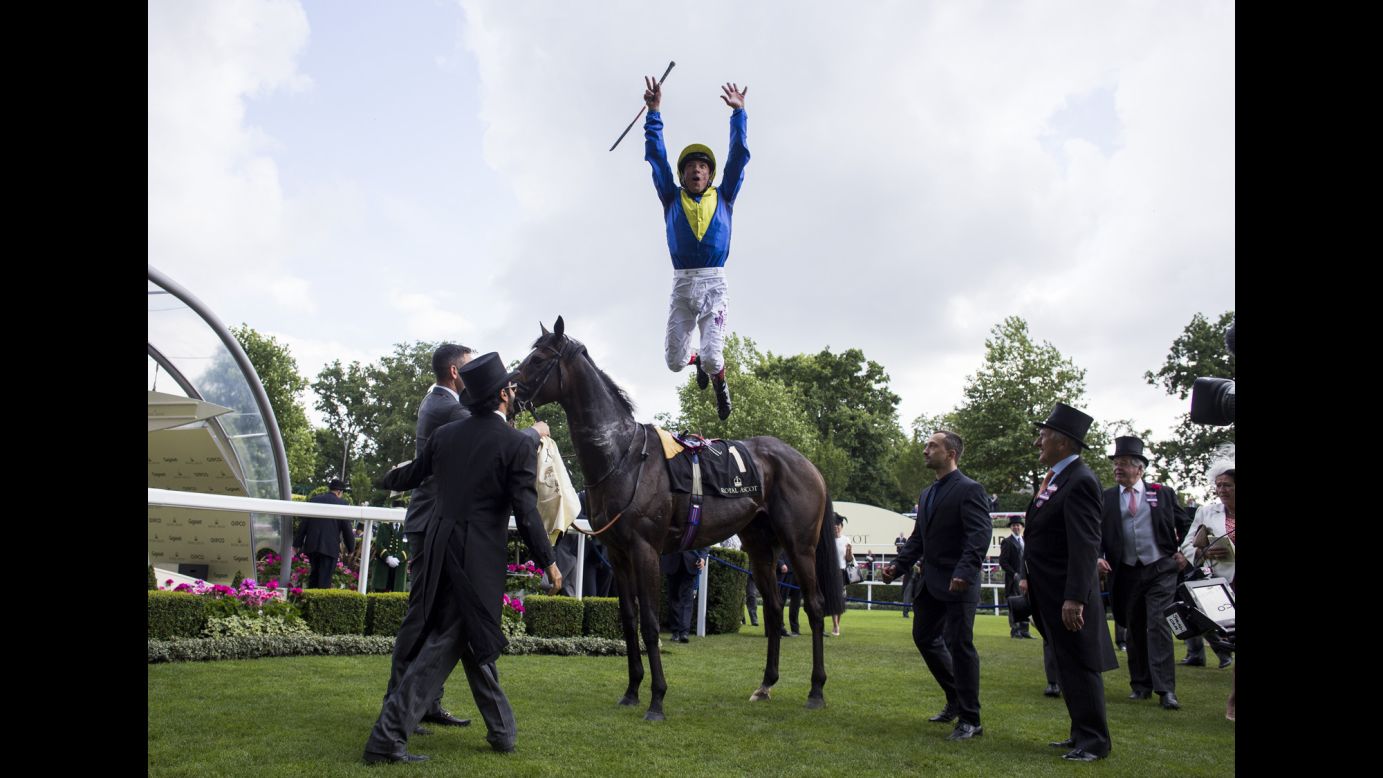Frankie Dettori dismounts from Across the Stars after winning a race in Ascot, England, on Friday, June 17.