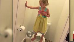 girl stands on toilet mother church intv_00000515.jpg