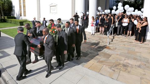 Pallbearers carry the casket of Brenda Lee Marquez-McCool in Orlando after her funeral service.