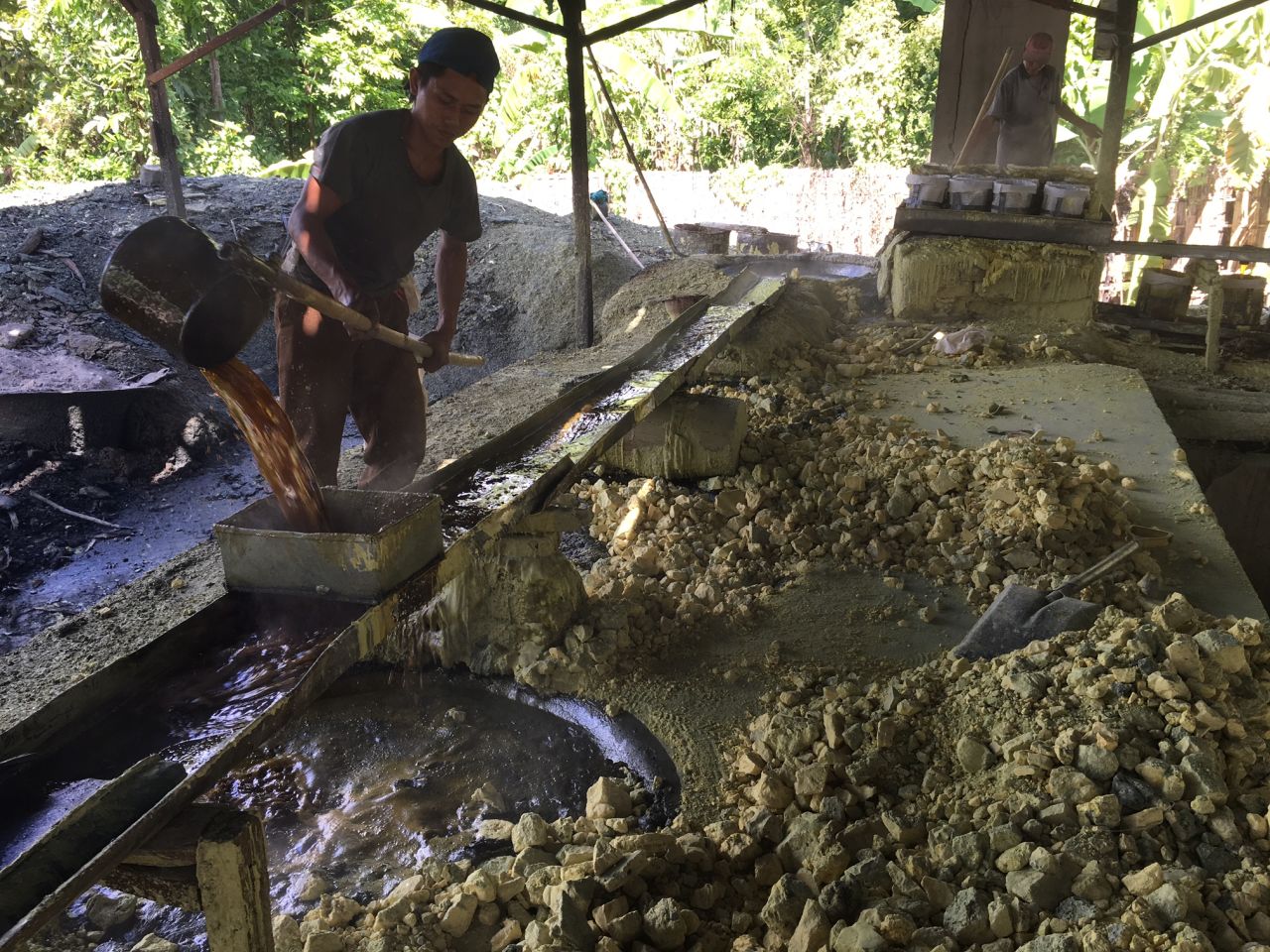 The sulfur is trucked down to a crude factory in the middle of the jungle.