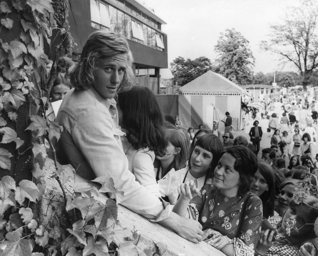 Swedish tennis player Bjorn Borg is mobbed by fans at Wimbledon in 1973.