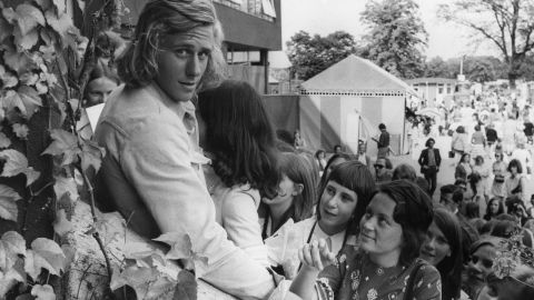 Swedish tennis player Bjorn Borg is mobbed by fans at Wimbledon in 1973.
