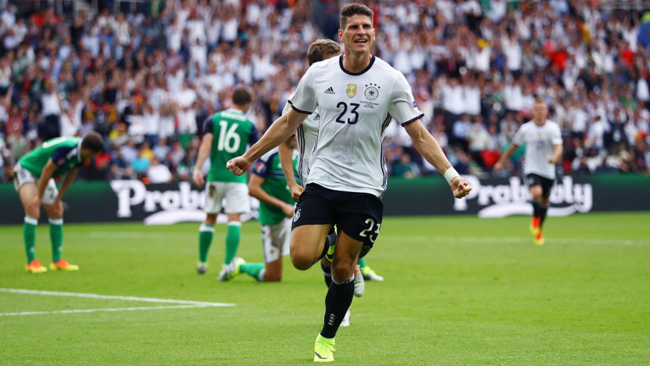 Mario Gomez celebrates after scoring for Germany in a 1-0 victory over Northern Ireland. Germany won Group C and will wait to see its opponent in the round of 16. Northern Ireland finished third in the group and clinched a round-of-16 spot with the Group D results later in the day.