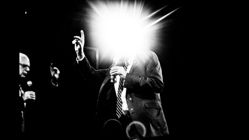 A flash of light obscures the head of U.S. Sen. Bernie Sanders as he speaks in Des Moines, Iowa, in October.