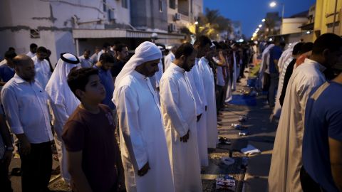 Bahraini demonstrators pray following a protest against the revocation of the citizenship of Qassim on June 20, 2016.