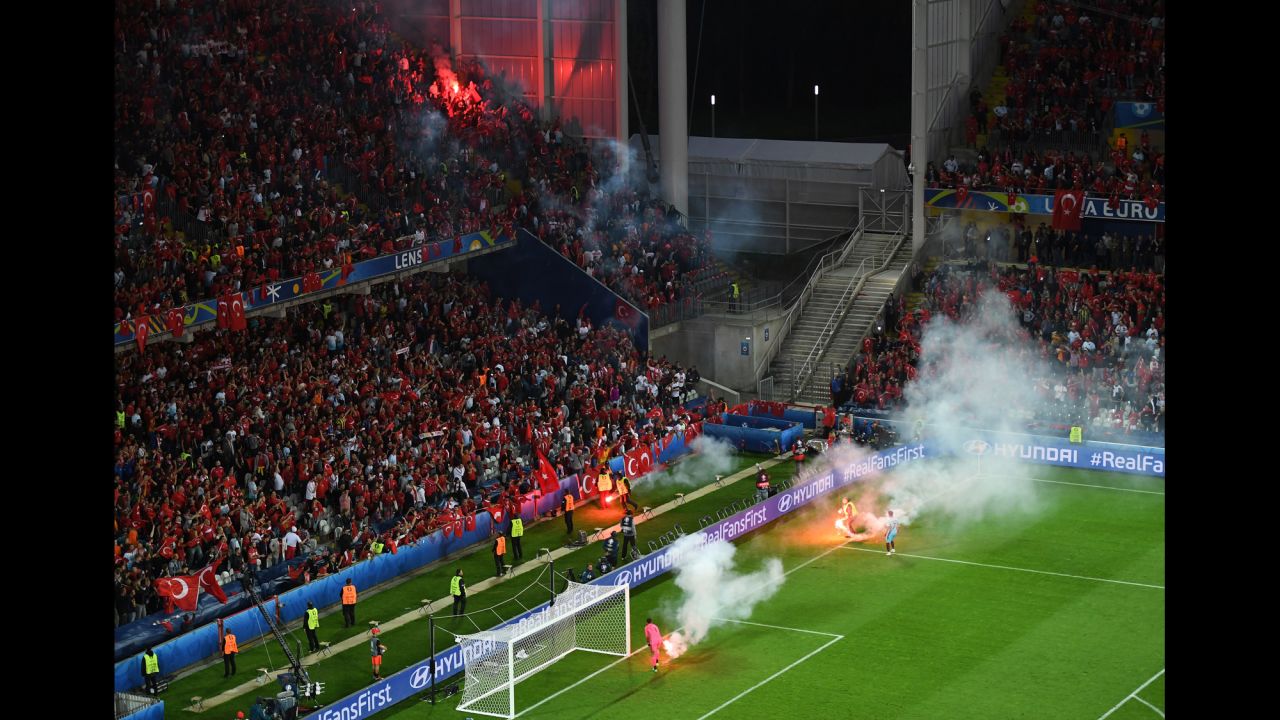 Flares were thrown on the field near Turkey's fans.