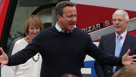 British Prime Minister David Cameron addresses a Bristol rally Wednesday with Harriet Harman and John Major.