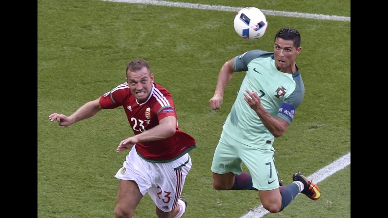 Portugal star Cristiano Ronaldo, right, heads in his second goal of the match. Portugal finished third in Group F and will play Croatia in the round of 16.