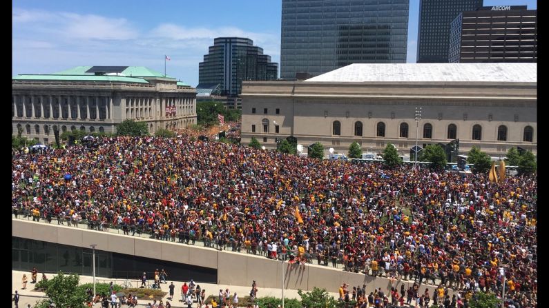 Fans gather to watch the parade in Cleveland. The city hadn't won a major sports title since 1964. <a href="index.php?page=&url=http%3A%2F%2Fwww.cnn.com%2F2016%2F06%2F20%2Fsport%2Fgallery%2Fcities-longest-championship-droughts%2Findex.html" target="_blank">See other championship droughts</a>