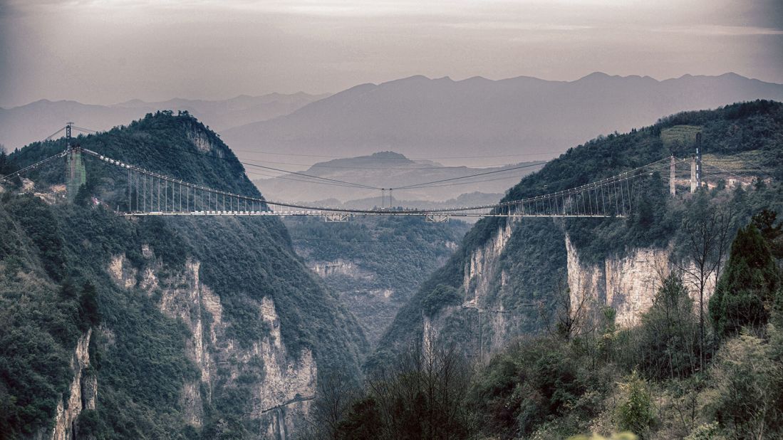 The glass-bottom bridge stretches across two hills and is 300 meters above ground. 