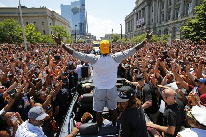 Cleveland Cavaliers star LeBron James stands in the back of a Rolls Royce as it makes its way through a victory parade in downtown Cleveland on Wednesday, June 22. The Cavaliers <a href="index.php?page=&url=http%3A%2F%2Fwww.cnn.com%2F2016%2F06%2F19%2Fsport%2Fgallery%2Fnba-finals-game-7%2Findex.html" target="_blank">won their first NBA title</a> on Sunday.