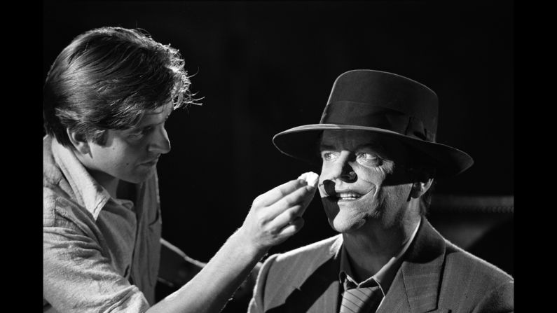 Jack Nicholson, who played the Joker, has makeup applied on set.