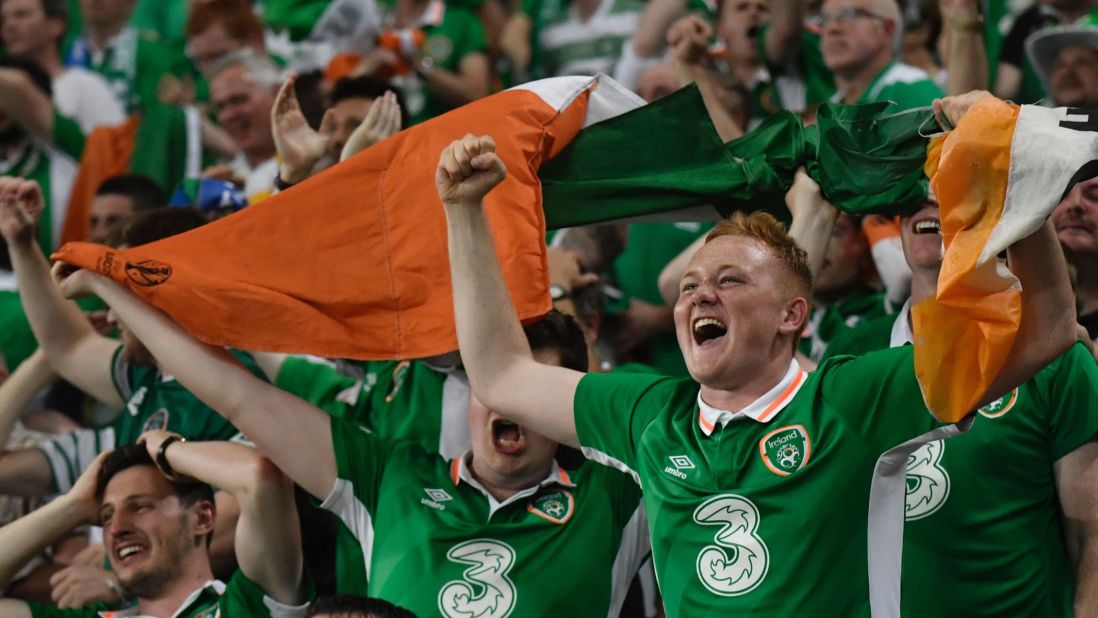 Irish supporters are jubilant following Brady's crucial goal.