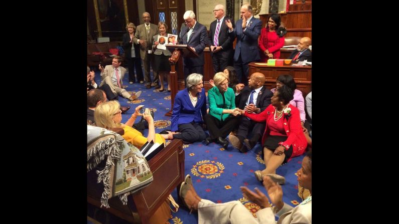 House Democrats sit on the House floor as they try to force a vote on gun control measures on Wednesday, June 22. The sit-in ended a day later, after the House GOP adjourned for a recess.