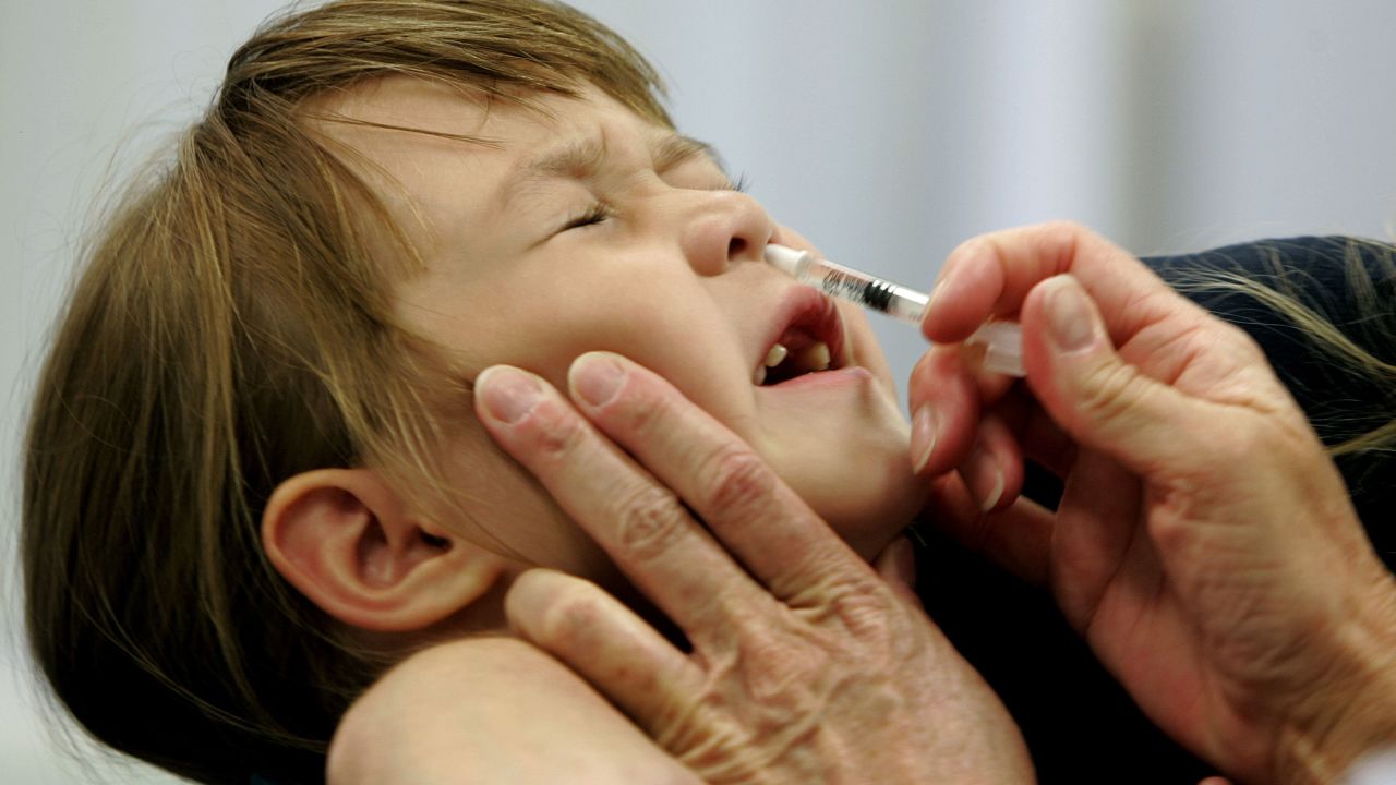 FILE- In this Oct. 4, 2005 file photo, a Danielle Holland reacts as she is given a FluMist influenza vaccination in St. Leonard, Md. On Wednesday, June 22, 2016, federal officials reported the latest in a growing series of study findings that show AstraZeneca's nasally-administered FluMist has not been working. (AP Photo/Chris Gardner, File)