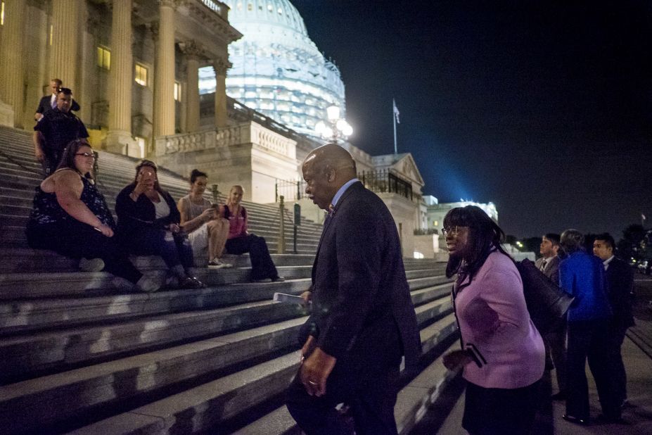 Lewis, a veteran of civil rights battles of the '60s, makes his way back to the Capitol after speaking to supporters on June 22.