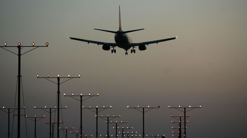 A jet comes in for landing at Los Angeles International Airport (LAX) on April 15, 2008 in Los Angeles, California. With skyrocketing fuel prices and a weak economy, US airlines are turning to mergers which could ultimately lead to higher fares through reduced flights and increased market power. US carriers emerged from a five-year slump in 2006 but with $35 billion in losses. In the latest merger move to save profits, Delta Air Lines Inc will buy Northwest Airlines Corp for more than $3 billion, creating the world's biggest airline. Recent profit challenges to the industry have lead to the shutdown of ATA, Skybus, and Aloha Airlines as well as bankruptcy for Frontier Airlines.  (Photo by David McNew/Getty Images)