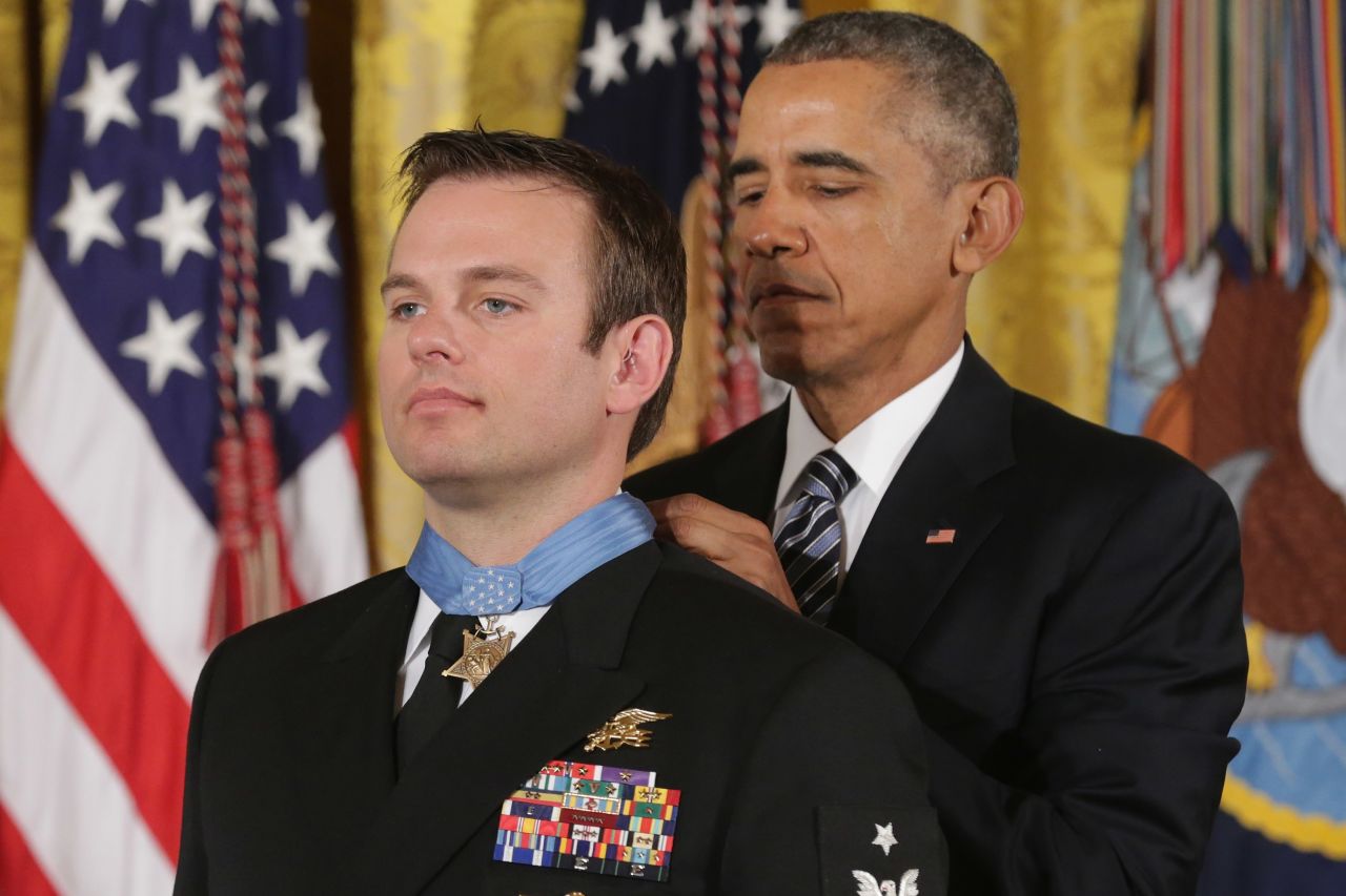 President Barack Obama presents Navy Senior Chief Edward Byers Jr., 36, with the Medal of Honor during a ceremony in the East Room of the White House February 29, 2016. A member of Navy SEAL Team 6, Byers received the Medal of Honor for his role in rescuing an American hostage from the Taliban in Afghanistan in December 2012.