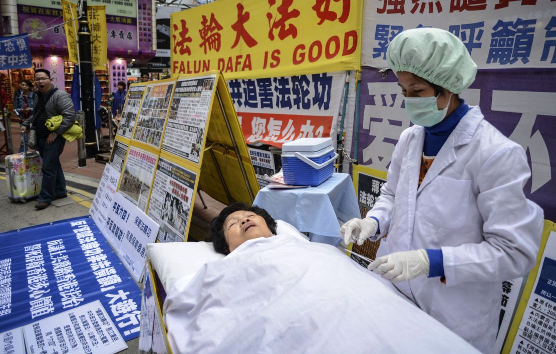 Falun Gong members stage a protest against China in Hong Kong. 