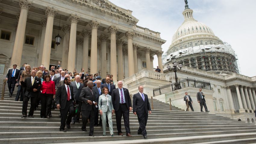 House members led by Minority Leader Nancy Pelosi (D-CA) and James Clyburn (D-SC), walk down the East Front of the U.S. Capitol building to speak with supporters on June 23, 2016 in Washington, DC. 