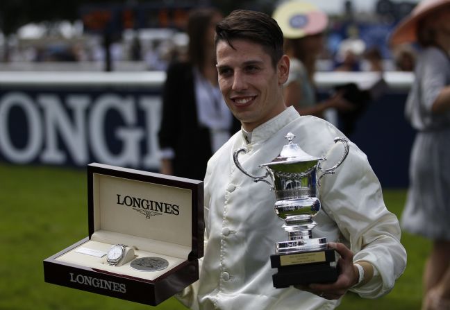 Demuro poses with his trophy after winning the Prix de Diane.