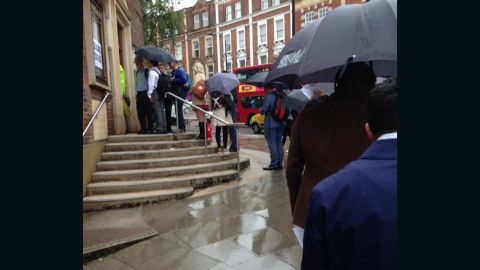 Rain doesn't deter voters from casting ballots in London's West Hampstead.