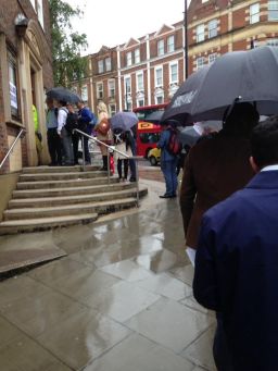 Voters line up in the rain to cast their votes in West Hampstead, London.