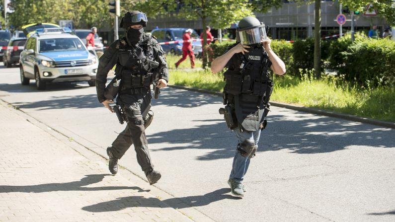 Police move outside a movie theater where a masked gunman <a href="http://www.cnn.com/2016/06/23/europe/germany-cinema-attack/index.html" target="_blank">took hostages</a> in Viernheim, Germany, on Thursday, June 23. The gunman was killed by police, officials said.