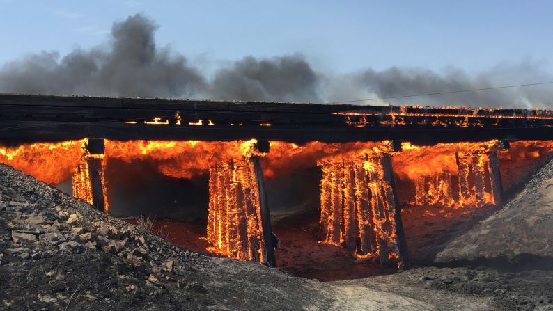 A railroad trestle burns near Haswell, Colorado, on Wednesday, June 22. More than a dozen wildfires have popped up throughout the Southwest as the region <a href="http://www.cnn.com/2016/06/21/us/fires-heat-wave-southwest-united-states/index.html" target="_blank">battles a lethal heat wave.</a>