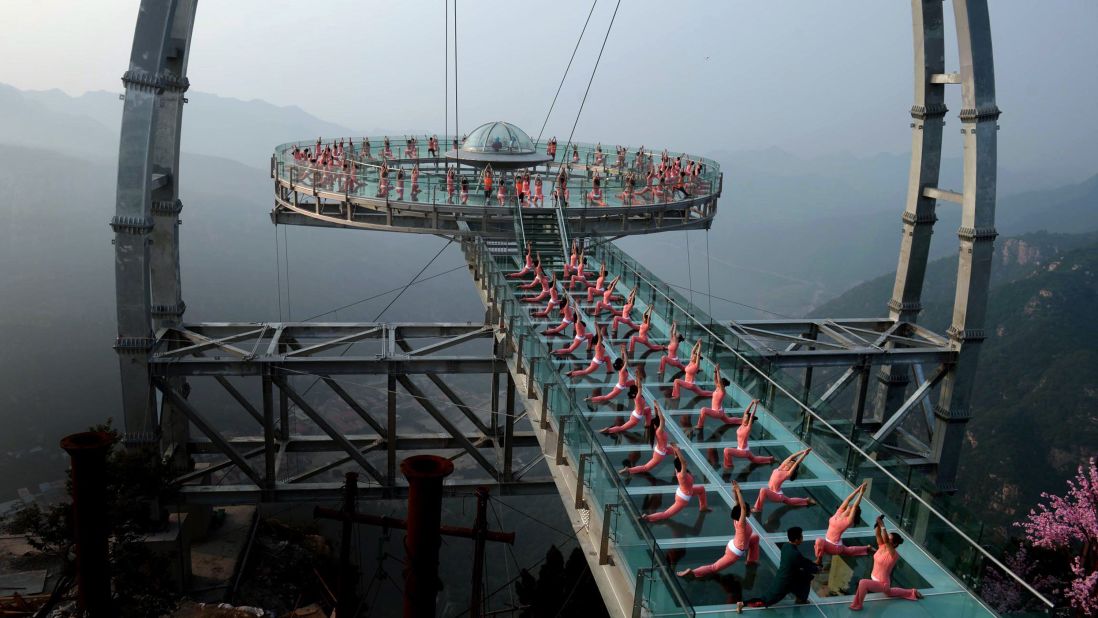 <strong>'Flying Saucer': </strong>Dubbed the "Flying Saucer," the circular Shilinxia<strong> </strong>walkway is suspended from the mountain, cantilever style. Made from titanium alloy, it can apparently hold a maximum load of 150 tons and 2,000 people. 