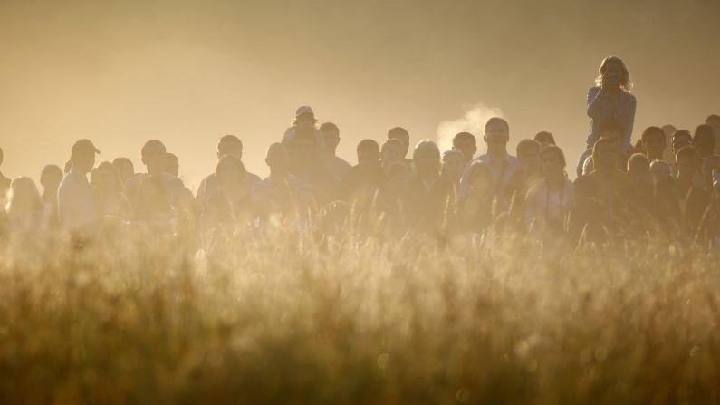 Spectators surrounded by morning fog watch battle re-enactments in Brest, Belarus, on Wednesday, June 22. It was the Day of Remembrance and Sorrow, 75 years after Germany attacked the Soviet Union during World War II.