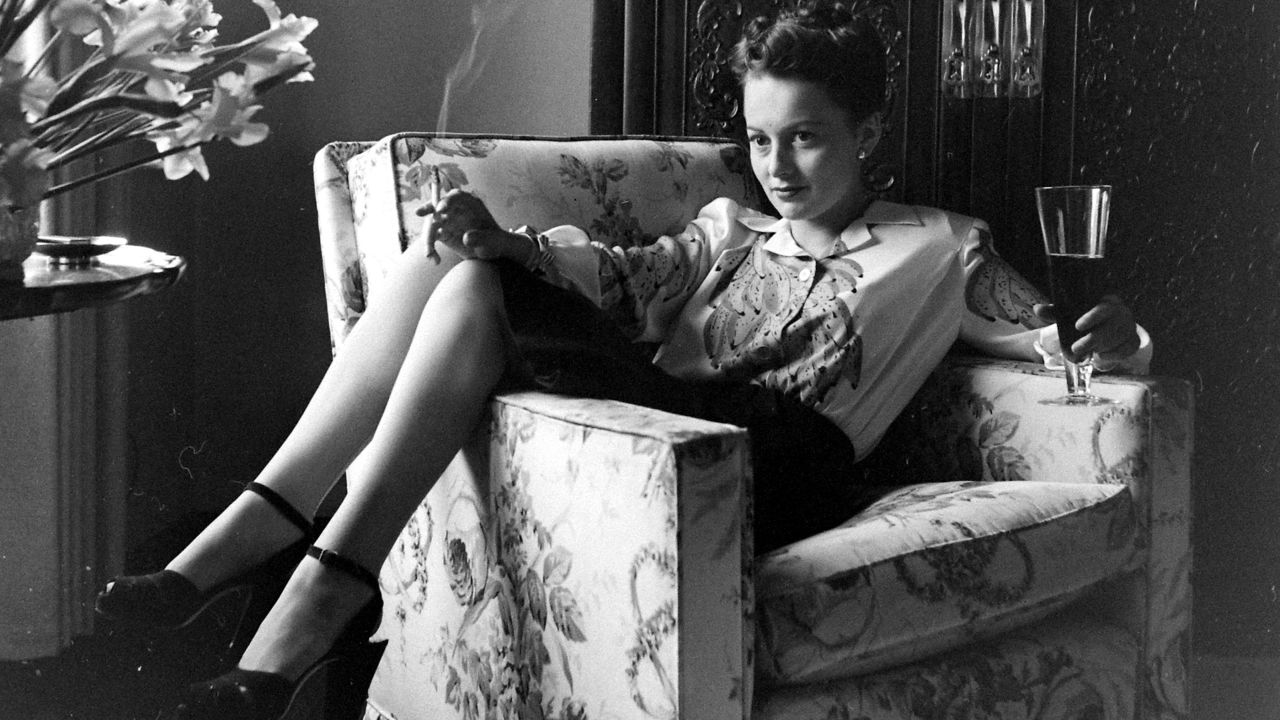 <a href="http://www.cnn.com/2013/01/21/us/olivia-de-havilland-fast-facts/">Olivia de Havilland</a> remains one of the last survivors of Hollywood's glamorous heyday of the 1930s and '40s. The star celebrates her 100th birthday on Friday, July 1. De Havilland, the personification of kind and genteel ladies in the movies, initially wanted to be a schoolteacher. But she began acting professionally at 18 and enjoyed a career that spanned from the mid-'30s to the late '80s. Here, in an uncharacteristic pose, she relaxes at home with a cigarette and beer in the early 1940s.