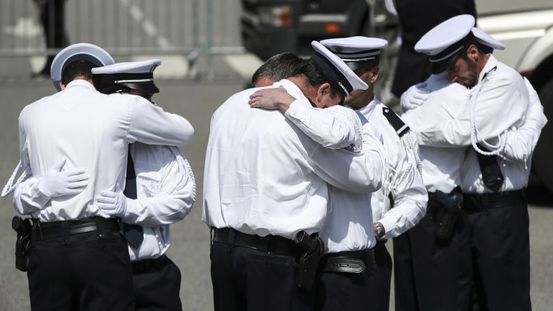 Police officers in Versailles, France, hug Friday, June 17, as they pay their final respects to Jean-Baptiste Salvaing and Jessica Schneider. Salvaing, a police commander, and Schneider, a civil servant who worked at a local police station, <a href="http://www.cnn.com/2016/06/16/europe/france-magnanville-terror-missed-signals-lister/" target="_blank">were killed at their home outside Paris</a> earlier in the week. The killer, who was shot dead by a SWAT team, declared his allegiance to the ISIS militant group in a video he recorded after taking over the couple's home.