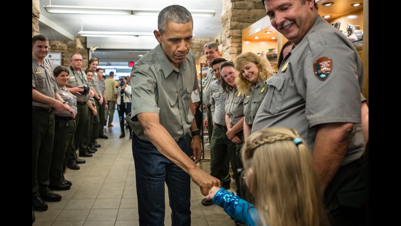 U.S. President Barack Obama fist-bumps a young girl Friday, June 17, as he and his family toured Carlsbad Caverns in New Mexico.