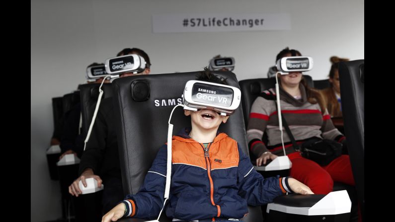 A boy plays a virtual-reality game in Paris on Sunday, June 19.