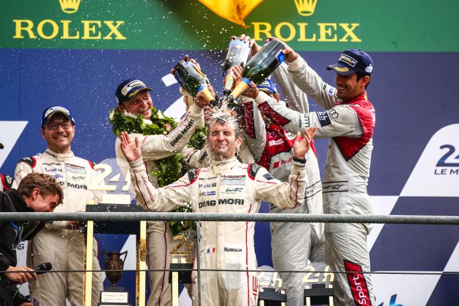 The Porsche team, which included Lucas di Grassi (far right), were gifted the win this year after the Toyota team broke down on the last lap.  