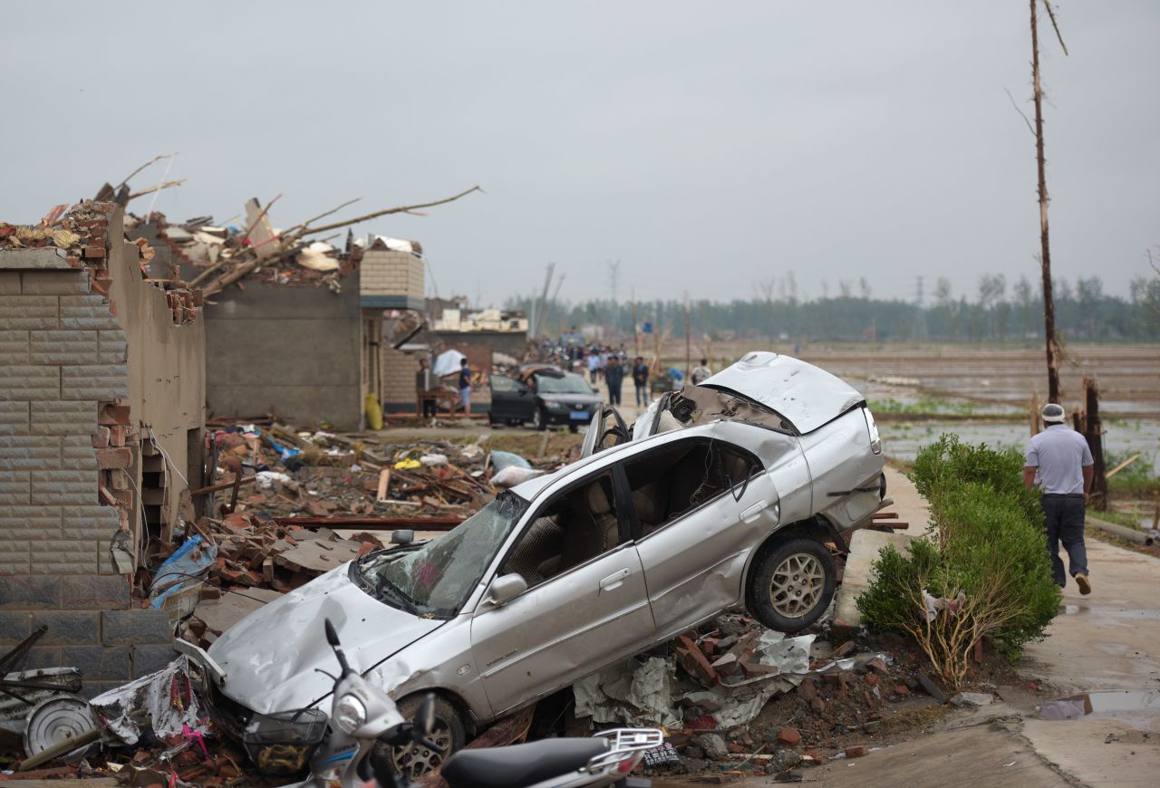 Destroyed properties are seen in Funing on June 24. The extreme winds tossed cars into the air in parts of Yancheng City, according to a statement by local authorities.