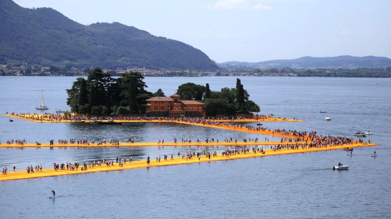The Floating Piers -- a new free installation by artist Christo -- lets the public walk between the mainland and the lake's two islands. 