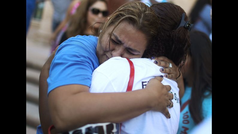 People comfort each other on the steps of Miami's Freedom Tower on Thursday, June 23, after the U.S. Supreme Court <a href="http://www.cnn.com/2016/06/23/politics/immigration-supreme-court/" target="_blank">was split</a> on executive actions that President Barack Obama imposed two years ago on immigration. The actions were meant to enable millions of eligible undocumented immigrants to receive temporary relief from the threat of deportation. Immigrants would have also been allowed to apply for programs that could qualify them for work authorization and associated benefits. But the Supreme Court's ruling means that the programs will remain blocked and the issue will return to the lower court.