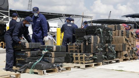 Members of the U.S. Coast Guard offload bails of cocaine in Miami Beach, Florida, on Monday, June 13. The drugs, with an estimated wholesale value of more than $214 million, were collected in international waters over the last two months.