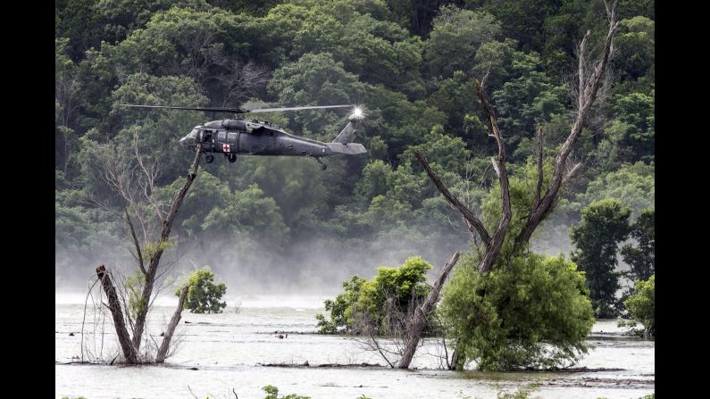 Army helicopters hover above Belton Lake on Friday, June 3, as they look for missing soldiers who were swept away by floodwaters in Texas. <a href="index.php?page=&url=http%3A%2F%2Fwww.cnn.com%2F2016%2F06%2F03%2Fus%2Ftexas-floods%2F" target="_blank">Nine soldiers from Fort Hood were killed</a> when their vehicle overturned during a training mission.