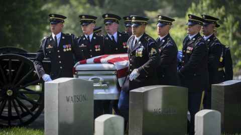 The remains of Stephanie Czech Rader are carried to her gravesite at Arlington National Cemetery on Wednesday, May 10. Rader, who died in January at the age of 100, was once a U.S. Army captain who served as an American spy in post-World War II Europe. She was posthumously awarded the Legion of Merit before her burial.