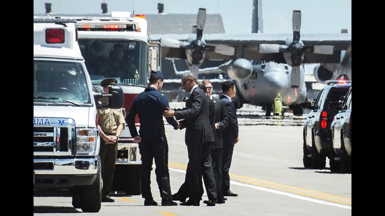 U.S. President Barack Obama shakes hands with Air Force Maj. Alex Turner, a pilot who safely ejected before <a href="index.php?page=&url=http%3A%2F%2Fwww.cnn.com%2F2016%2F06%2F02%2Fpolitics%2Fmilitary-plane-crash%2F" target="_blank">his Thunderbird F-16 crashed</a> near Colorado Springs, Colorado, on Thursday, June 2. Just before the crash, Turner was taking part in a flyover at the U.S. Air Force Academy's commencement ceremony. The President was attending the event.