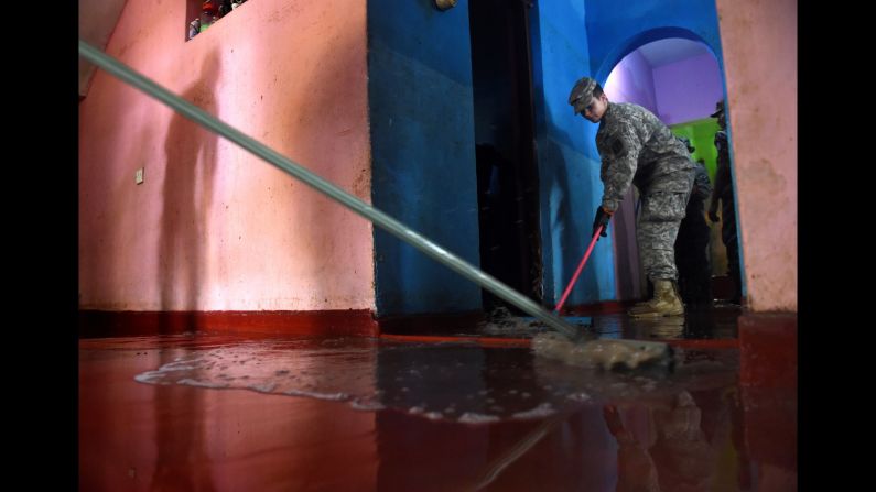 U.S. Army cadets clear flood damage in the Kolonnawa suburb of Colombo, Sri Lanka, on Wednesday, June 1.