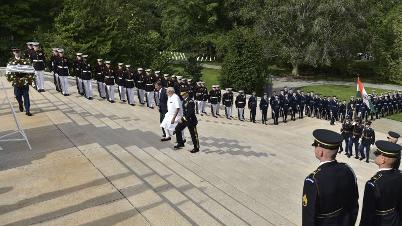 Indian Prime Minister Narendra Modi, in white, arrives for a wreath-laying ceremony at Arlington National Cemetery on Monday, June 6. He is accompanied by U.S. Defense Secretary Ashton Carter and U.S. Army. Maj. Gen. Bradley Becker. Modi <a href="index.php?page=&url=http%3A%2F%2Fwww.cnn.com%2F2016%2F06%2F07%2Fworld%2Fgallery%2Fmodi-us-visit%2Findex.html" target="_blank">was in Washington</a> for a three-day visit.