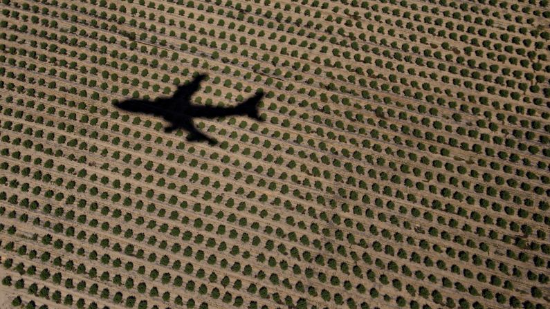 The shadow of Air Force One is seen on farmland as it takes off in Merced County, California, on Sunday, June 19.